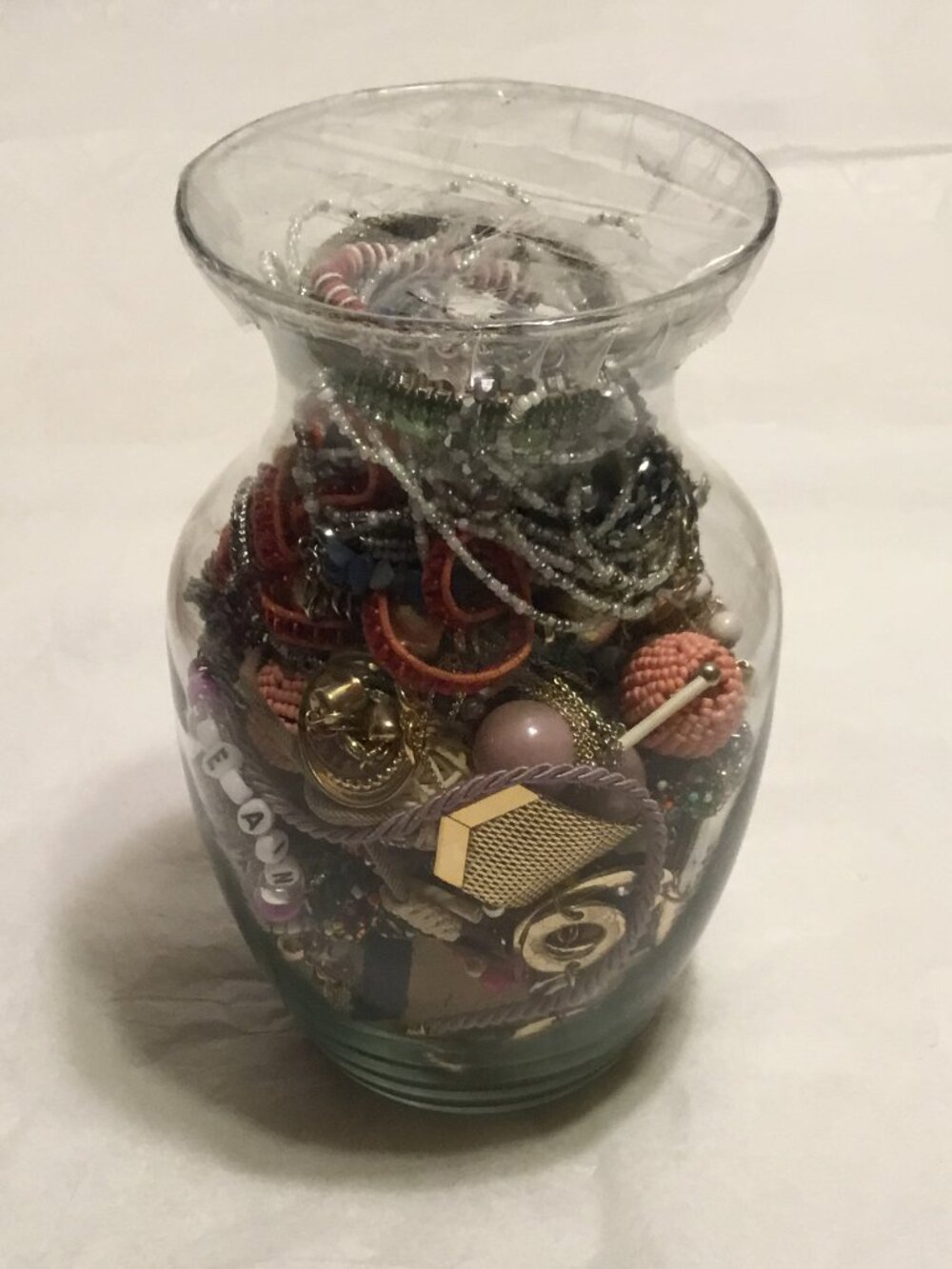Large heavy vase filled with lots of good wearable jewelry necklaces, bracelets